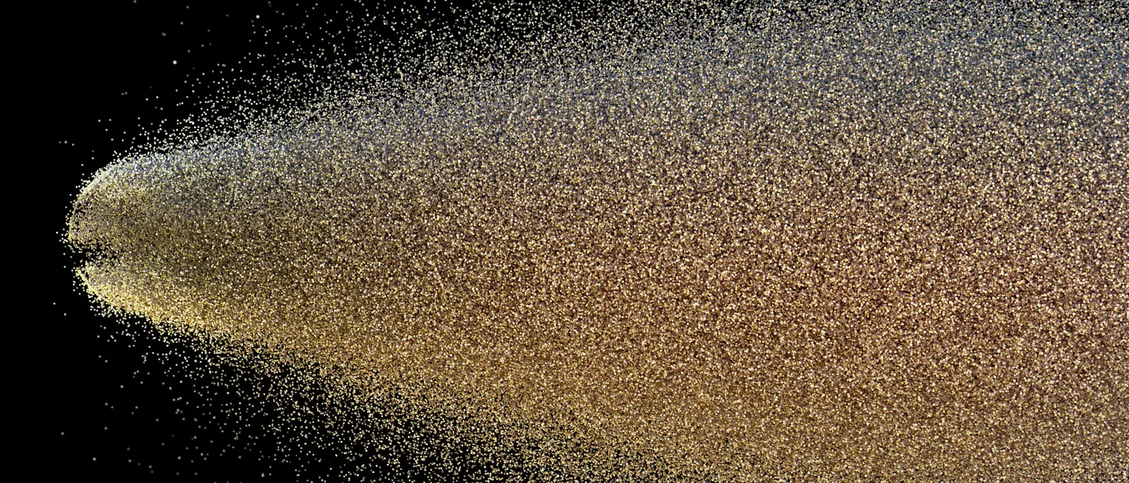 Nube de microgotas dispersándose contra un fondo negro